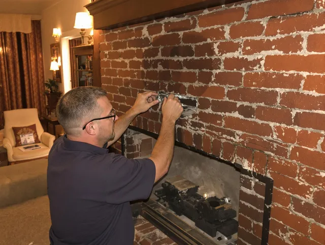 Claremont Chimney Sweep expert fixing a fireplace in Claremont, CA